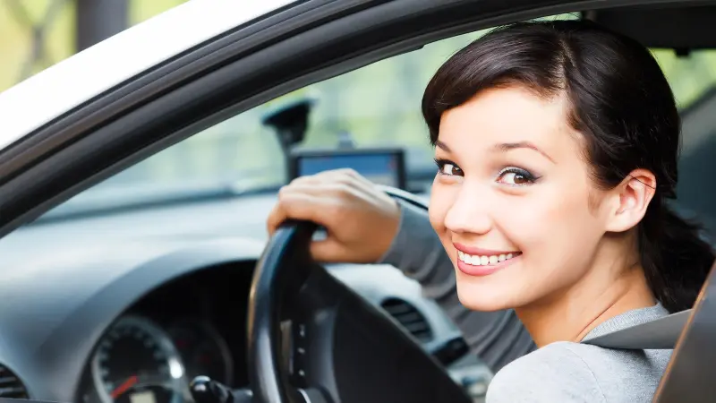 Smiling driver behind the wheel