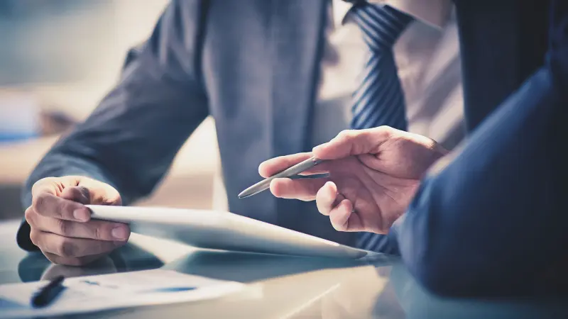 Advisor reviewing documents on a tablet